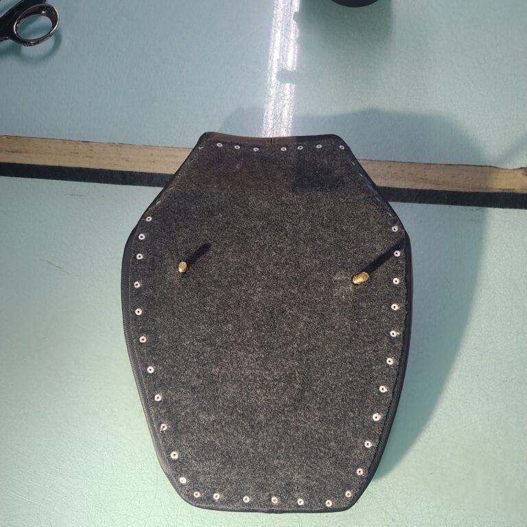 Motorcycle seat pan recovering